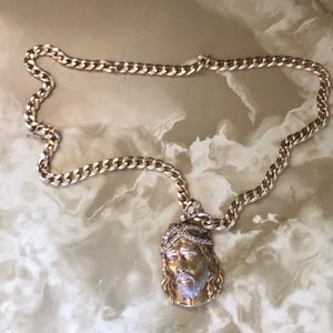 10 karat gold chain and Jesus piece charm